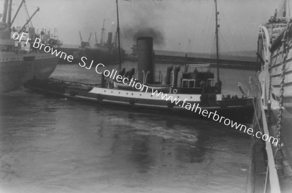 ENTERING PORT:TUG IN DOCK